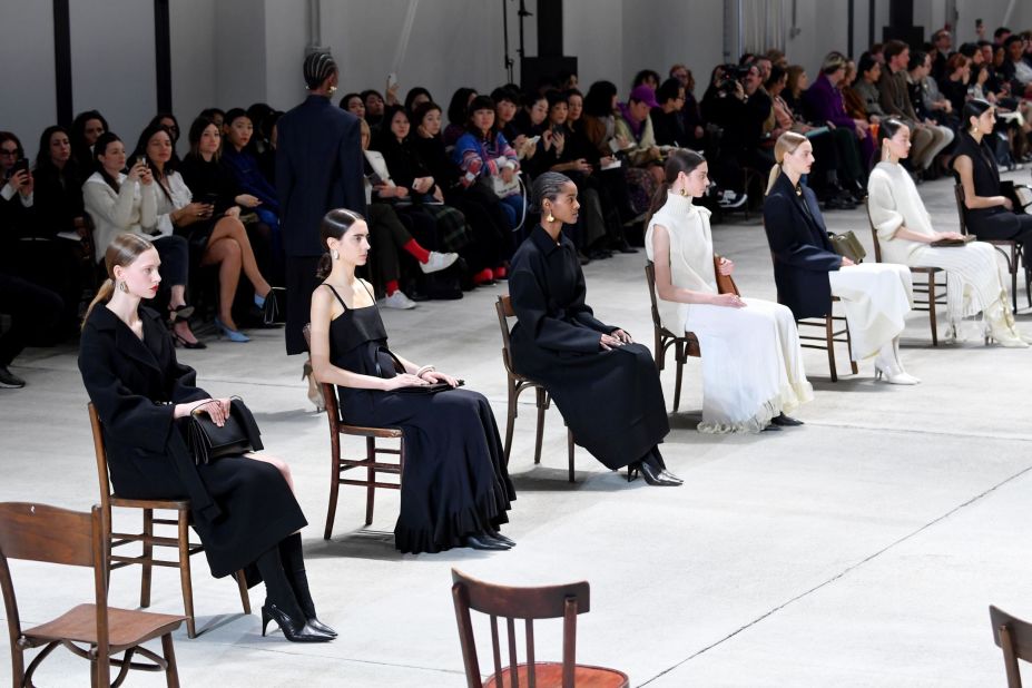 At Jil Sander, Luke and Lucie Meier made their models sit in a large square of chairs with their backs to the audience.