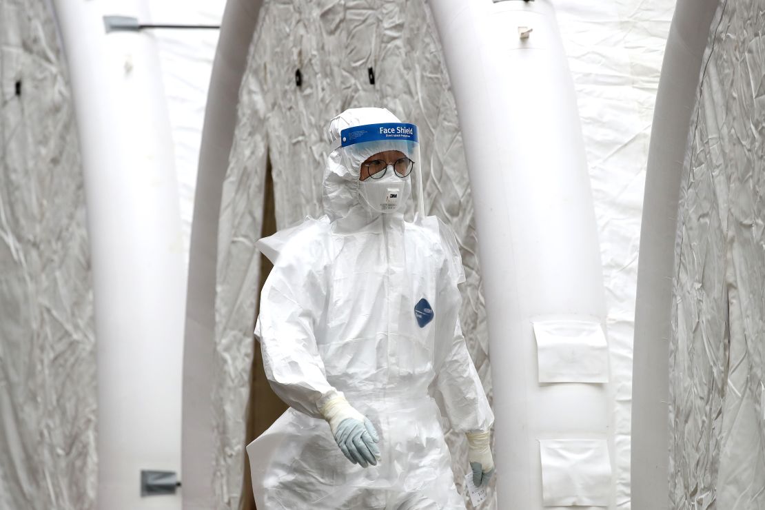 A medical professional is seen at a preliminary testing facility at the National Medical Center where patients suspected of contracting coronavirus are assessed on February 21, 2020 in Seoul, South Korea. 