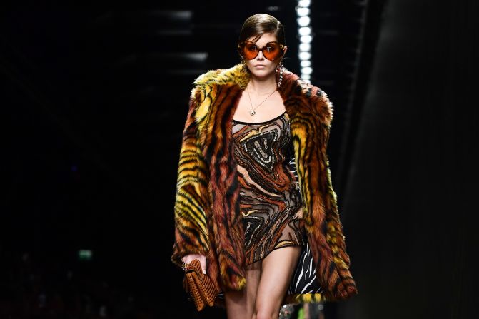 Model Kaia Gerber presents a creation for Versace. Click through the gallery to see more from Milan Fashion Week.