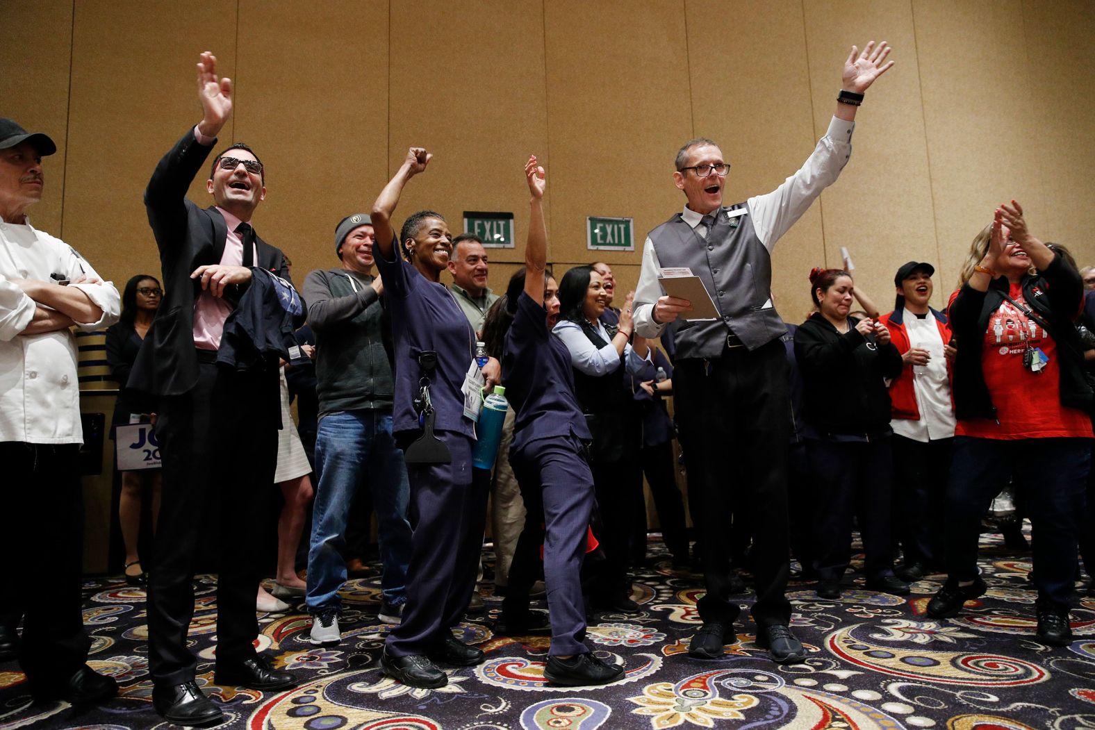 Casino workers and Biden supporters cheer during the caucus at the Bellagio hotel in Las Vegas.