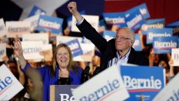 Democratic presidential candidate Sen. Bernie Sanders, I-Vt., right, with his wife Jane, raises his hand as he speaks during a campaign event in San Antonio, Saturday, Feb. 22, 2020.