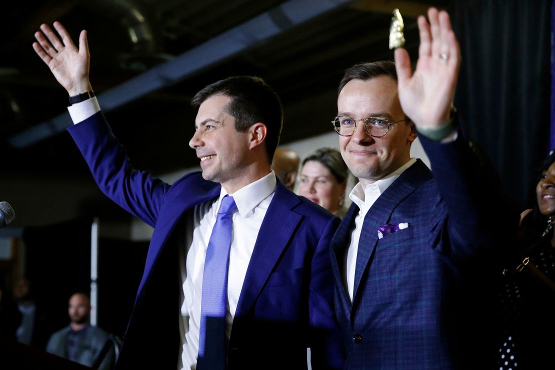 Buttigieg, left, and his husband Chasten Buttigieg acknowledge supporters after speaking at a caucus night event, Saturday, Feb. 22, 2020, in Las Vegas. (AP Photo/Patrick Semansky)