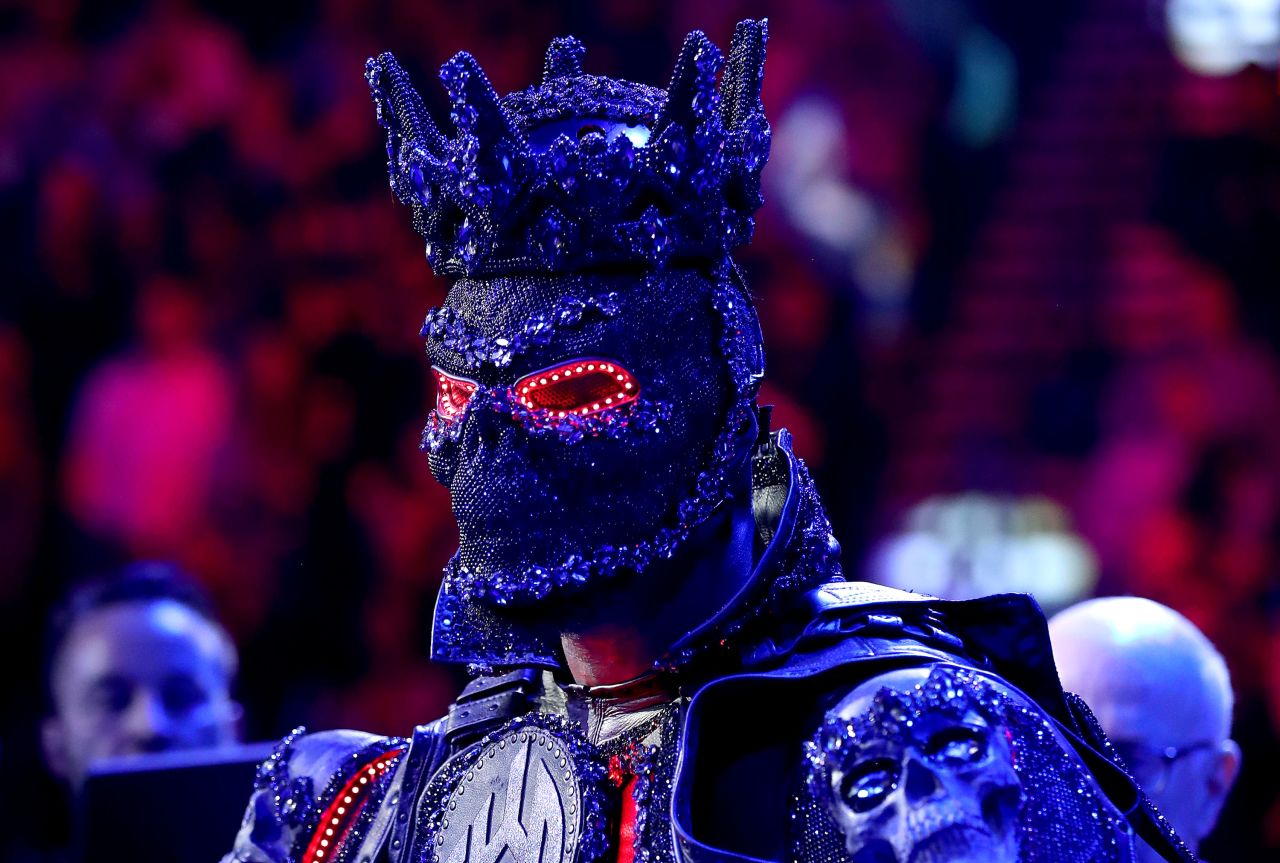Deontay Wilder of the United States enters the ring wearing a mask.