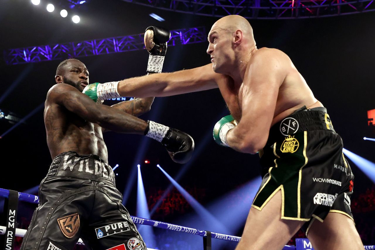 Fury punches Wilder at the beginning of the match.