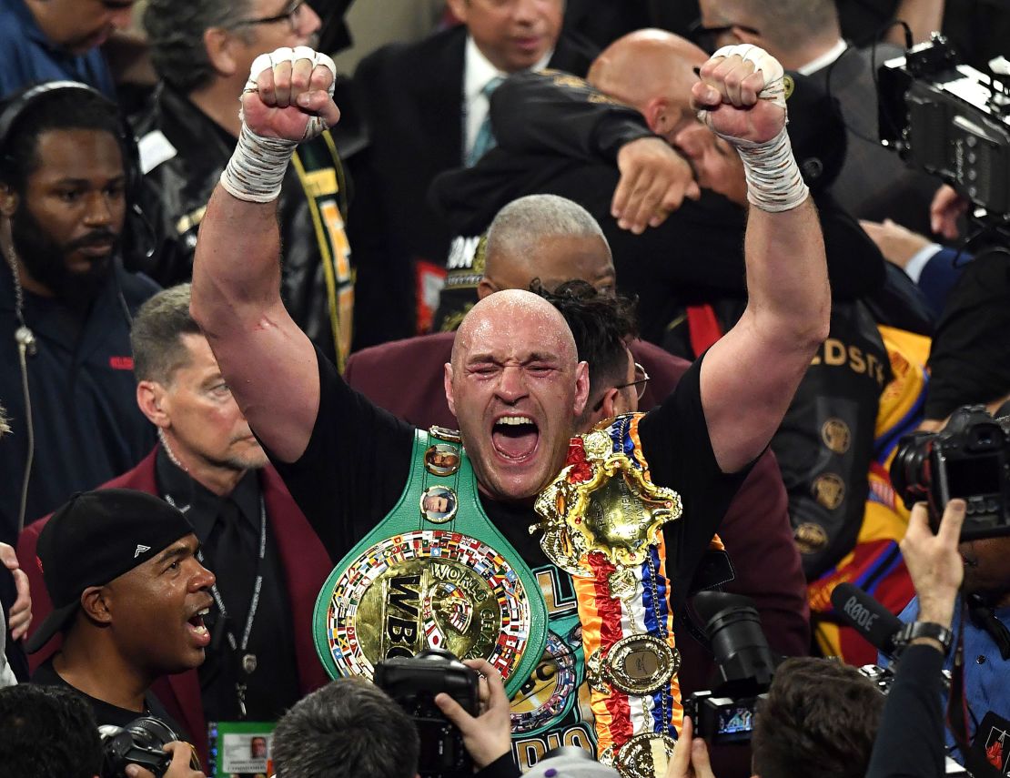 British boxer Tyson Fury celebrates after defeating US boxer Deontay Wilder. 