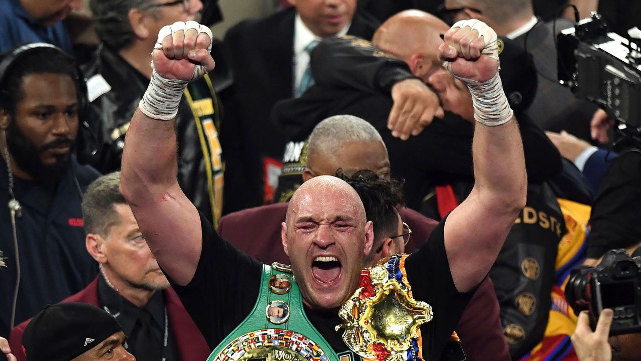 British boxer Tyson Fury celebrates after defeating US boxer Deontay Wilder.