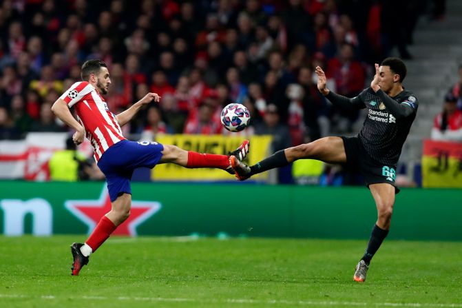 Atletico Madrid's Koke, left, and Liverpool's Trent Alexander-Arnold fight for the ball during the Champions League match between the teams in Madrid on February 18, 2020. Atletico Madrid put on a <a href="index.php?page=&url=https%3A%2F%2Fwww.cnn.com%2Feurope%2Flive-news%2Fchampions-league-live-blog-liverpool-atletico-psg-dortmund-spt-intl%2Findex.html" target="_blank">masterclass of defending</a> as it edged out reigning champion Liverpool 1-0.