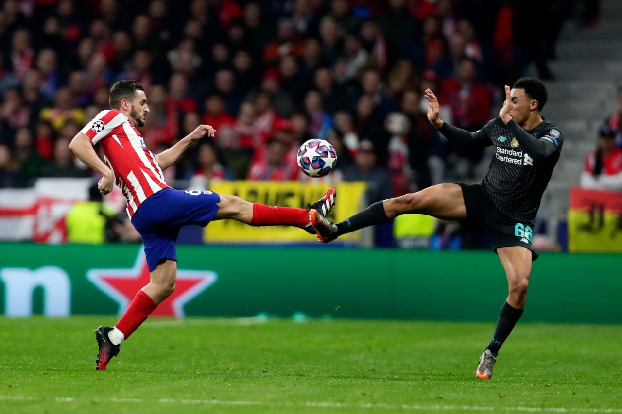 Atletico Madrid's Koke, left, and Liverpool's Trent Alexander-Arnold fight for the ball during the Champions League match between the teams in Madrid on February 18, 2020. Atletico Madrid put on a <a href="https://www.cnn.com/europe/live-news/champions-league-live-blog-liverpool-atletico-psg-dortmund-spt-intl/index.html" target="_blank">masterclass of defending</a> as it edged out reigning champion Liverpool 1-0.