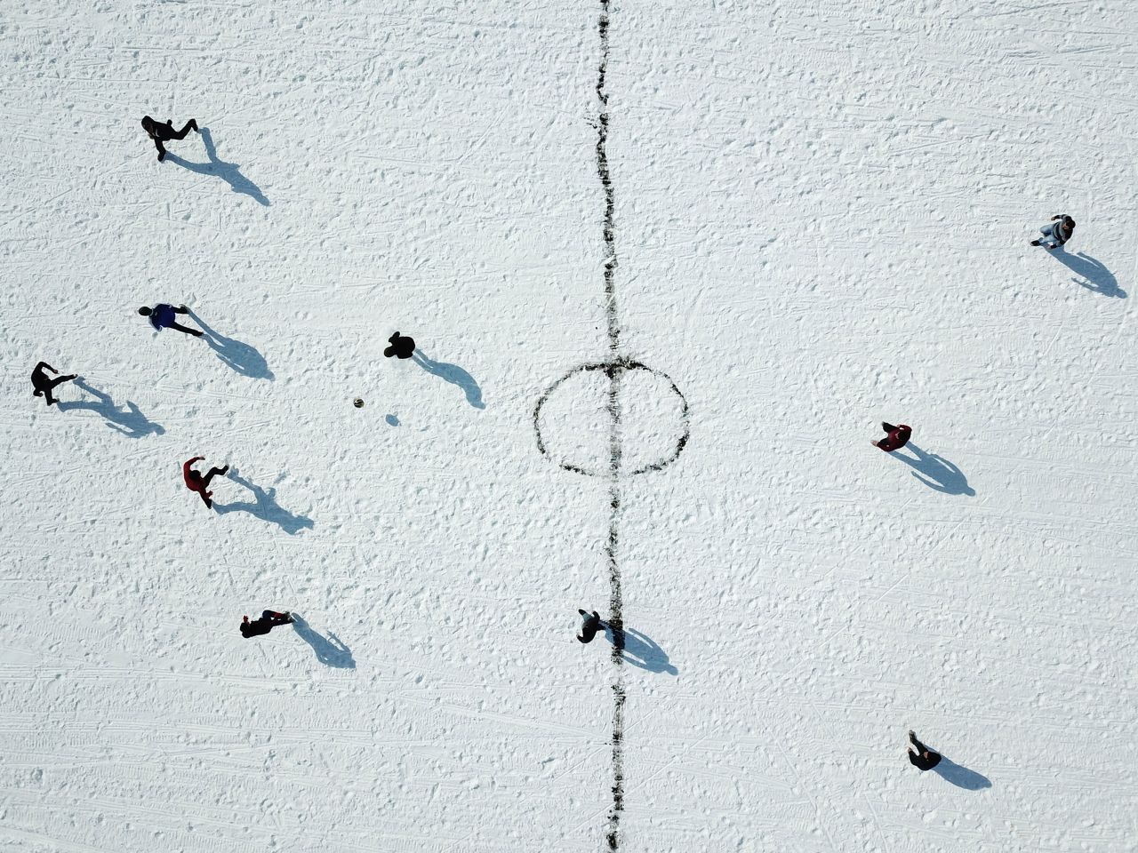 Youth play soccer on the ice-covered surface of Lake Cildir in Kars, Turkey on February 16.