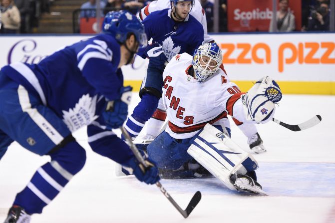 Carolina Hurricanes emergency goalie David Ayres defends against the Toronto Maple Leafs in Toronto on February 22. The Hurricanes won 6-3 and at 42 years and 194 days, Ayres became the <a href="index.php?page=&url=https%3A%2F%2Fwww.cnn.com%2F2020%2F02%2F23%2Fsport%2Fdave-ayres-nhl-debut%2Findex.html" target="_blank">oldest goaltender in league history</a> to win his regular-season debut. Ayres, who needed a kidney transplant and had two bouts of skin cancer, is a Zamboni driver for the Toronto Marlies of the American Hockey League.