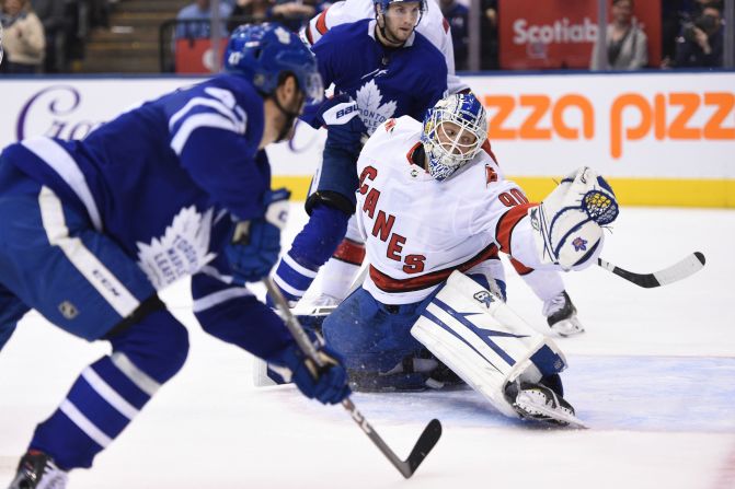 Carolina Hurricanes emergency goalie David Ayres defends against the Toronto Maple Leafs in Toronto on February 22. The Hurricanes won 6-3 and at 42 years and 194 days, Ayres became the <a  target="_blank">oldest goaltender in league history</a> to win his regular-season debut. Ayres, who needed a kidney transplant and had two bouts of skin cancer, is a Zamboni driver for the Toronto Marlies of the American Hockey League.