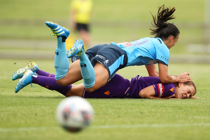 Amy Sayer of Sydney FC lands on Leticia McKenna of Perth Glory after being tackled during a match in Wollongong, Australia, on February 22. The Glory won 2-1.