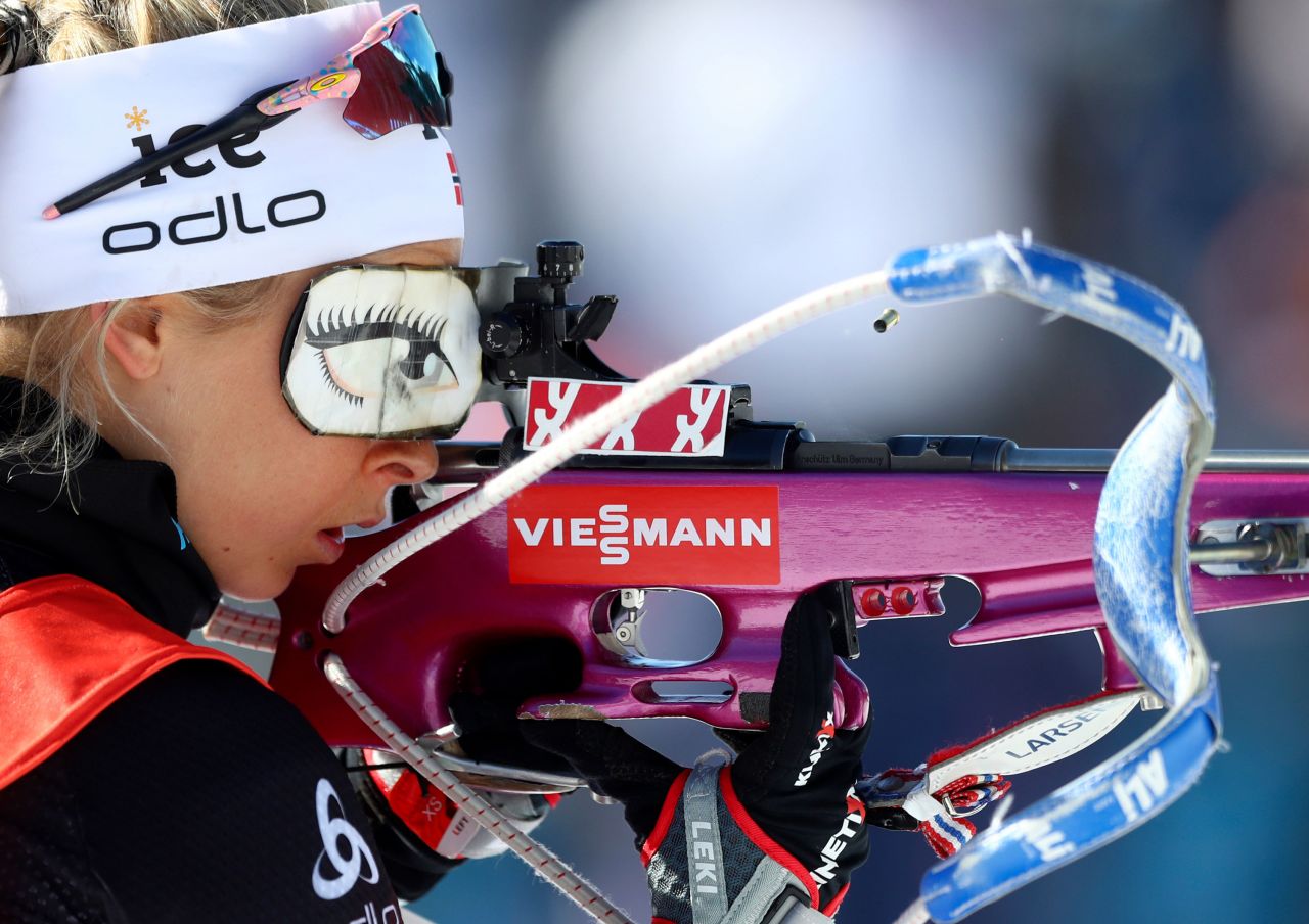 A spent cartridge is ejected by Ingrid Landmark Tandrevold's rifle during warmup before the women's 4x6 km relay competition at the Biathlon World Championships in Antholz-Anterselva, Italy.