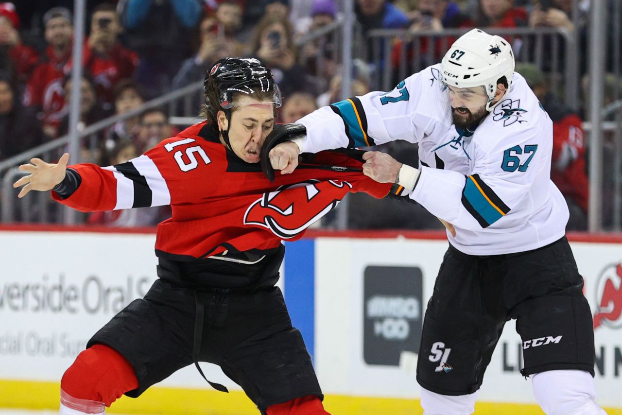 San Jose Sharks defenseman Jacob Middleton and New Jersey Devils center John Hayden slug it out during the first period at Prudential Center on February 20. The Devils won 2-1.
