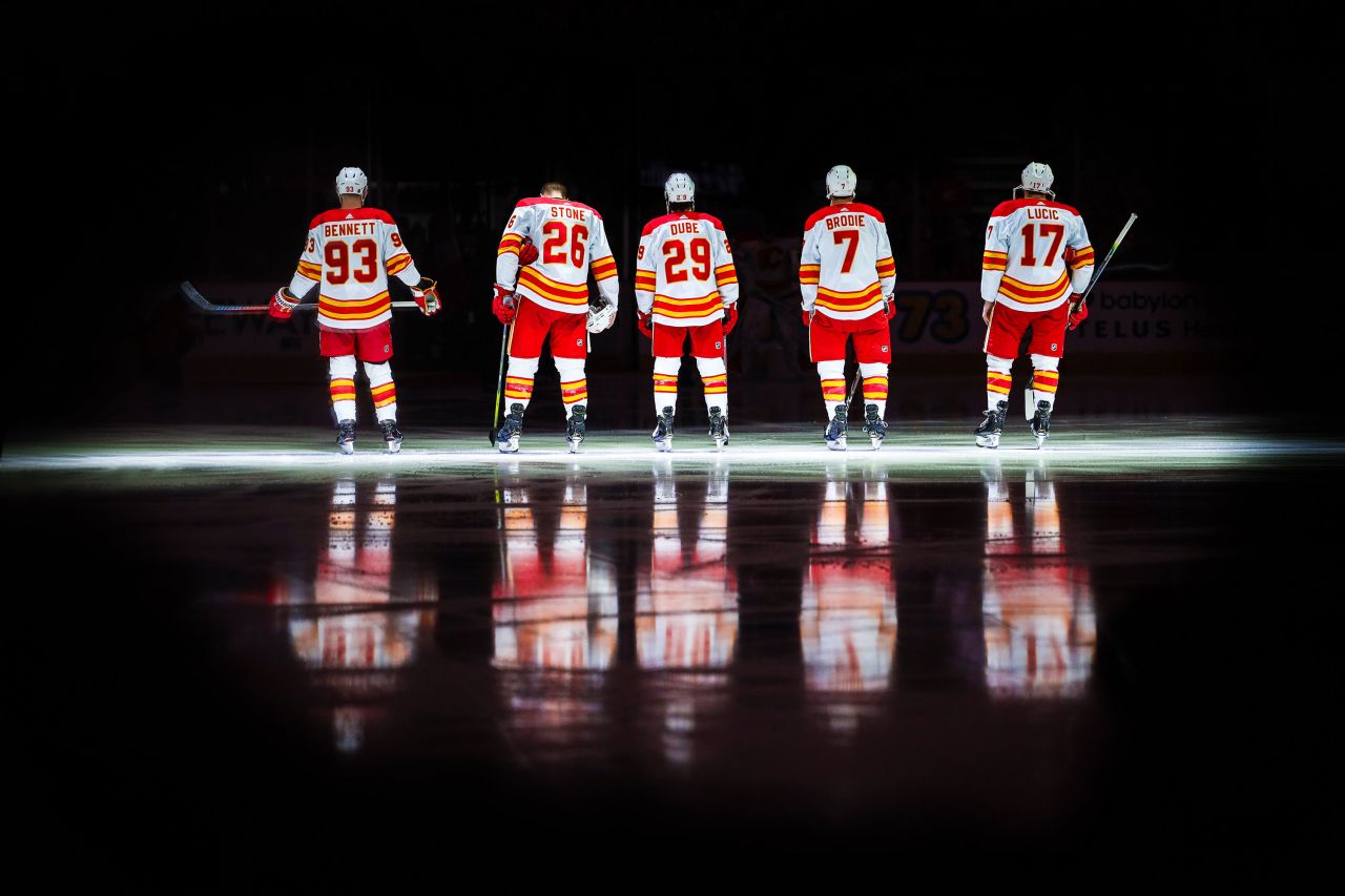 The starting lineup of the Calgary Flames wait for their match to begin against the Anaheim Ducks at Scotiabank Saddledome on Feburary 17. 