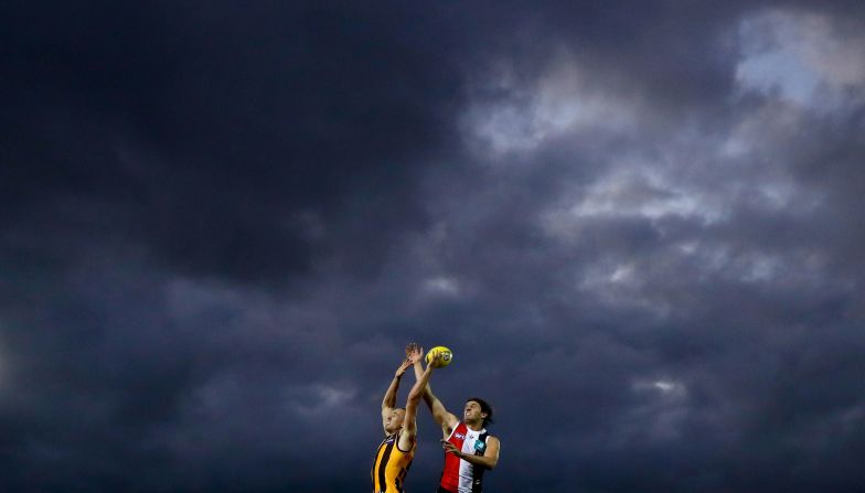 Tom Scully of the Hawks and Hunter Clark of the Saints compete for the ball during a rugby match on February 20 in Melbourne, Australia. 