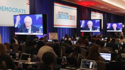 Senator Bernie Sanders, an Independent from Vermont and 2020 presidential candidate, is seen on television screens in the spin room during the Democratic presidential candidate debate in Las Vegas, Nevada, U.S., on Wednesday, Feb. 19, 2020. Beneath all of the sparring between candidates leading up to the debate is a broader strategic question that Democrats must address: Whether the best way to beat President Donald Trump in November is by reassuring moderates with kitchen-table proposals or by bolstering turnout with aggressive ideas that create a clear contrast.