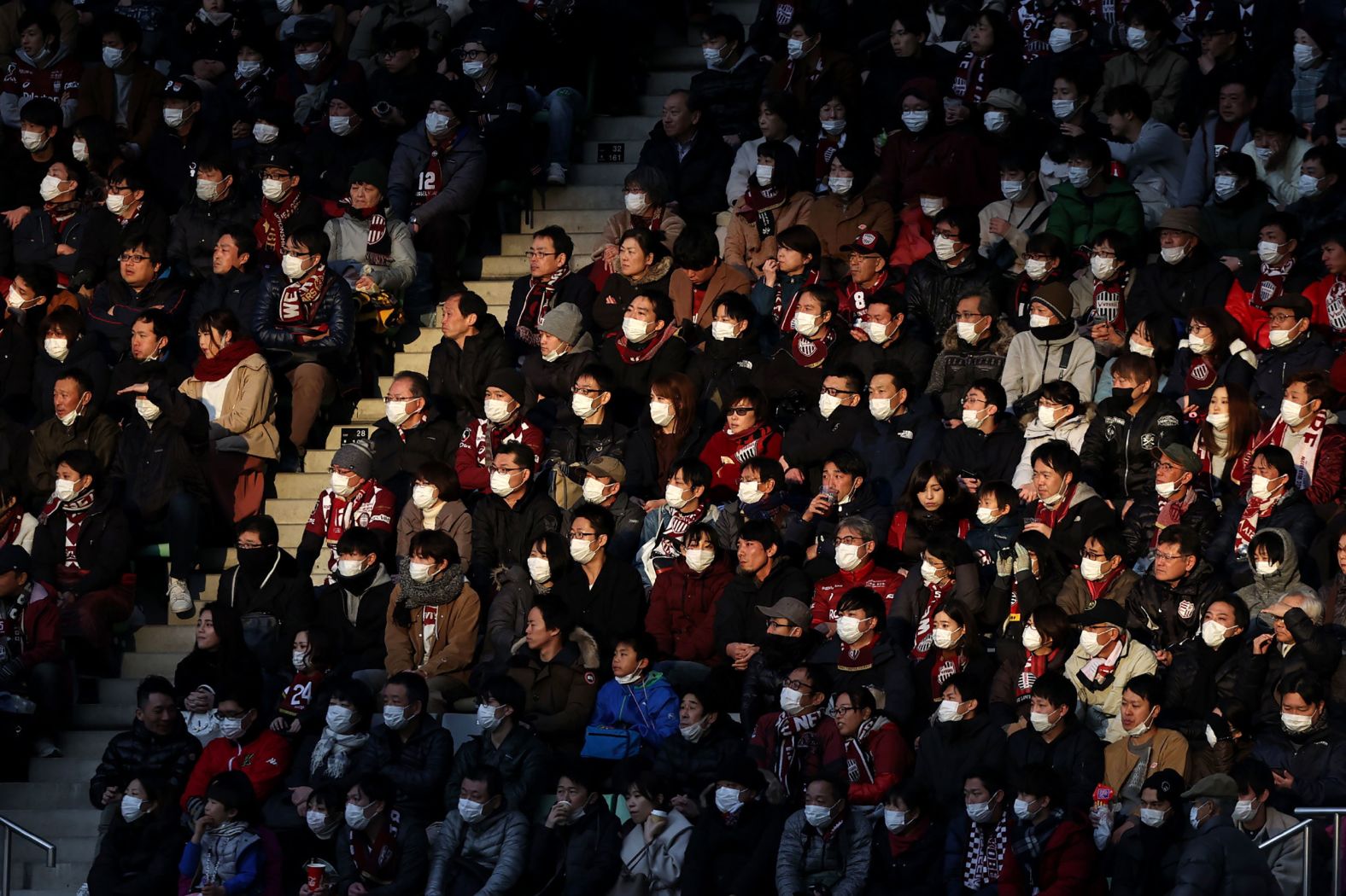 People attend a professional soccer match in Kobe, Japan, on February 23, 2020. To help stop the spread of the novel coronavirus, the soccer club Vissel Kobe <a href="index.php?page=&url=https%3A%2F%2Fwww.espn.com%2Fsoccer%2Fvissel-kobe%2Fstory%2F4057914%2Finiestas-vissel-kobe-ban-singing-chanting-due-to-coronavirus-threat" target="_blank" target="_blank">told fans not to sing, chant or wave flags</a> in the season opener against Yokohama FC.