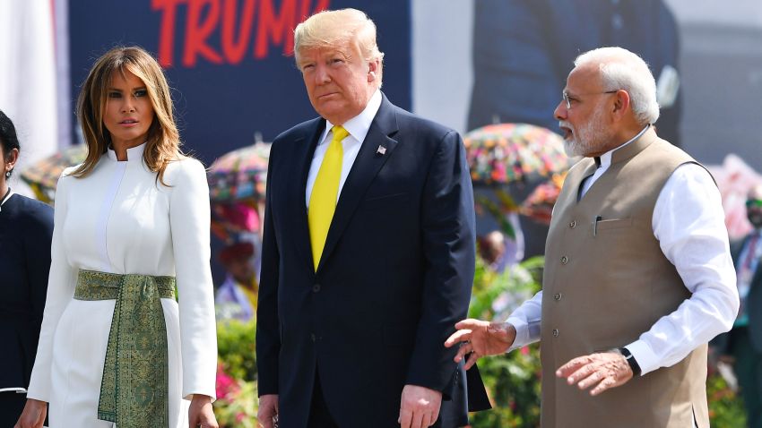 India's Prime Minister Narendra Modi (R) speaks with US President Donald Trump (C) and First Lady Melania Trump (L) upon their arrival at Sardar Vallabhbhai Patel International Airport in Ahmedabad on February 24, 2020.