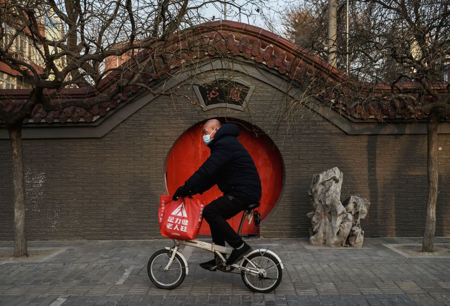 A man rides his bike in Beijing on February 23, 2020.