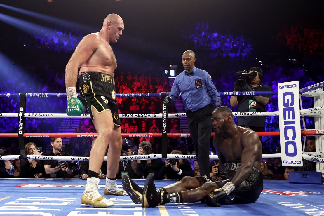 Tyson Fury knocks down Deontay Wilder in the fifth round of their fight.