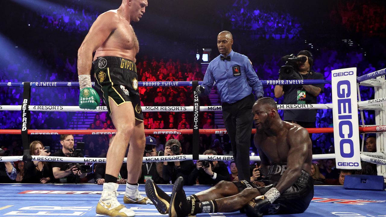 Tyson Fury knocks down Deontay Wilder in the fifth round of their fight.
