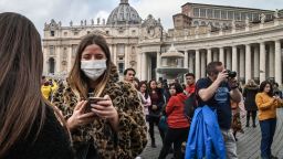 A tourist wearing a protective respiratory mask waits on St. Peter's Square prior to the Pope's weekly Angelus prayer on February 2, 2020 in the Vatican. - A virus similar to the SARS pathogen has killed more than 300 people in China and spread around the world since emerging in a market in the central Chinese city of Wuhan. On February 2, China's National Health Commission said more than 14,000 people have been infected by the novel coronavirus. (Photo by ANDREAS SOLARO / AFP) (Photo by ANDREAS SOLARO/AFP via Getty Images)