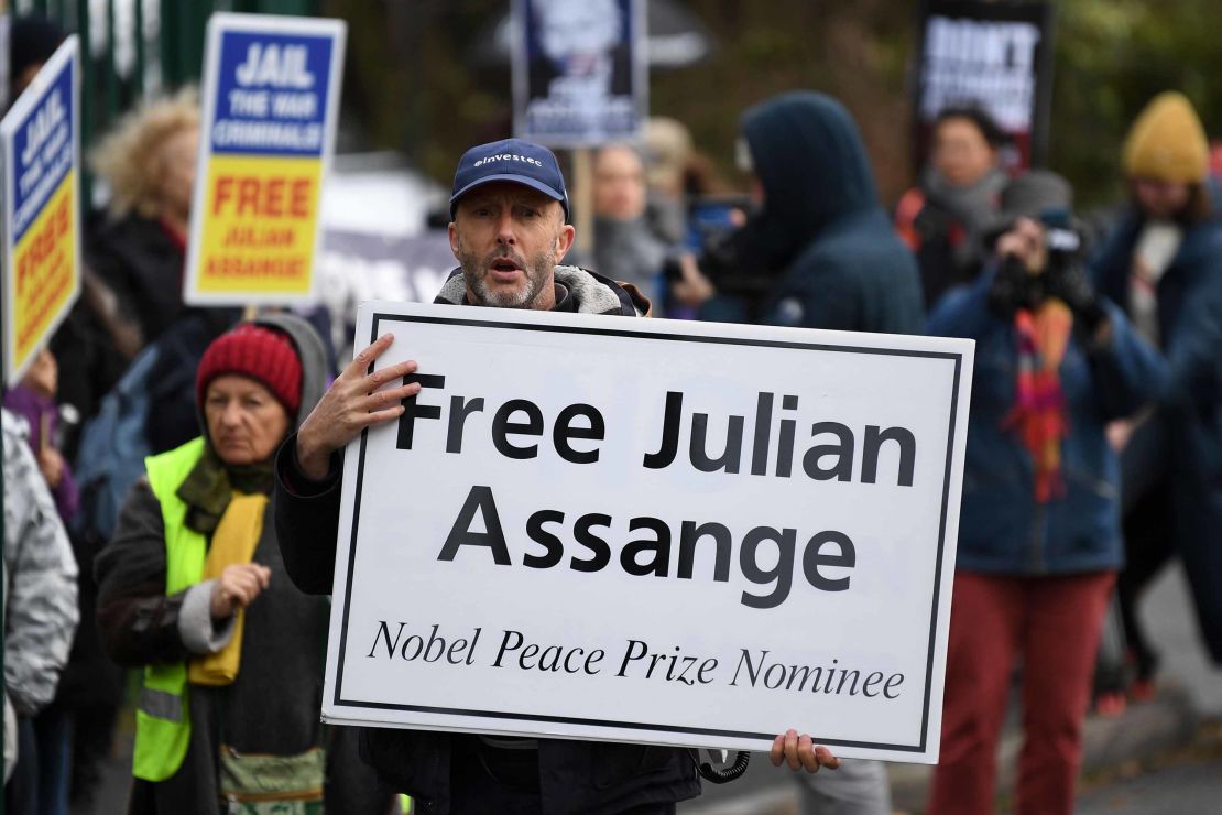 Supporters of WikiLeaks founder Julian Assange, hold placards calling for his freedom outside Woolwich Crown Court on Monday.