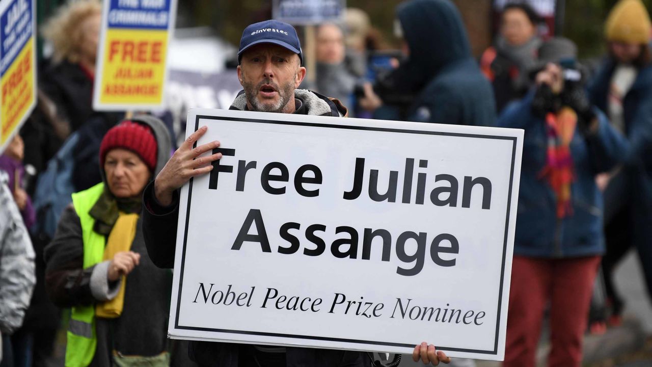 Supporters of WikiLeaks founder Julian Assange, hold placards calling for his freedom outside Woolwich Crown Court on Monday.