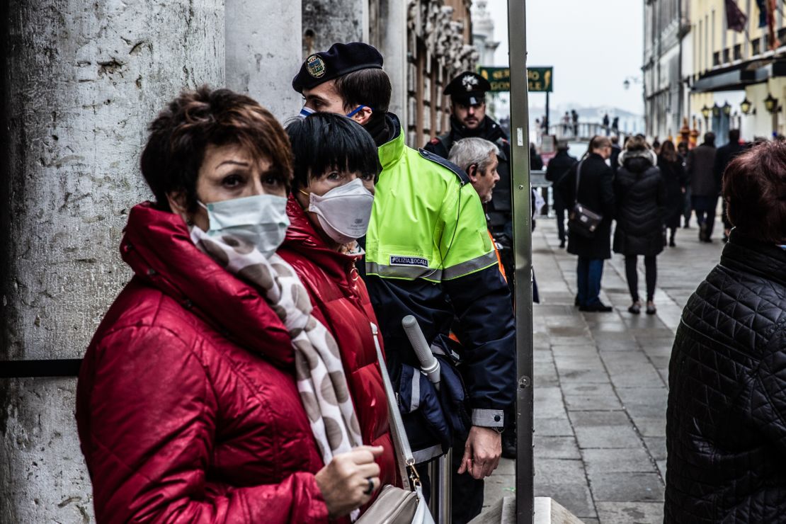 People wearing protective masks in Venice on Sunday.