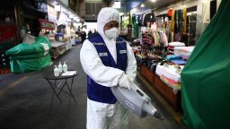 SEOUL, SOUTH KOREA - FEBRUARY 24: A disinfection professional wears protective gear spray anti-septic solution against the coronavirus (COVID-19) at a traditional market on February 24, 2020 in Seoul, South Korea. South Korea has raised the coronavirus alert to the "highest level" as confirmed case numbers keep rising. Government reported 161 new cases of the coronavirus (COVID-19) bringing the total number of infections in the nation to 763, with the potentially fatal illness spreading fast across the country. (Photo by Chung Sung-Jun/Getty Images)