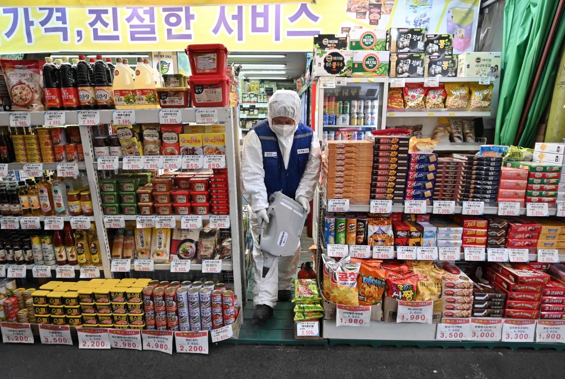A worker sprays disinfectant to help prevent the spread of the  coronavirus in Seoul.