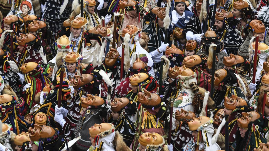 <strong>Rottweil, Germany:</strong> Masked revelers prepare to take part in Carnival on, Monday, February 24.