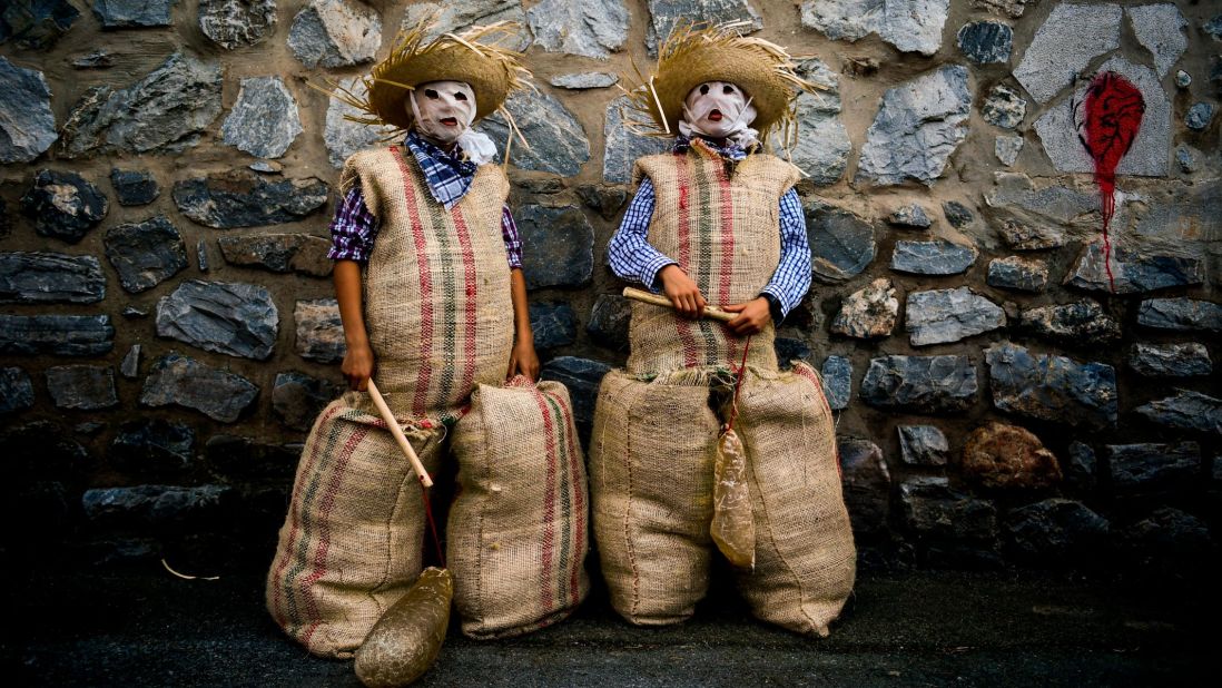 <strong>Lesaka, Spain:</strong> Participants dressed as the traditional carnival characters "Zaku Zaharrak," or Old Sack in Basque language, pose while taking part in a Carnival parade on Sunday, February 23.