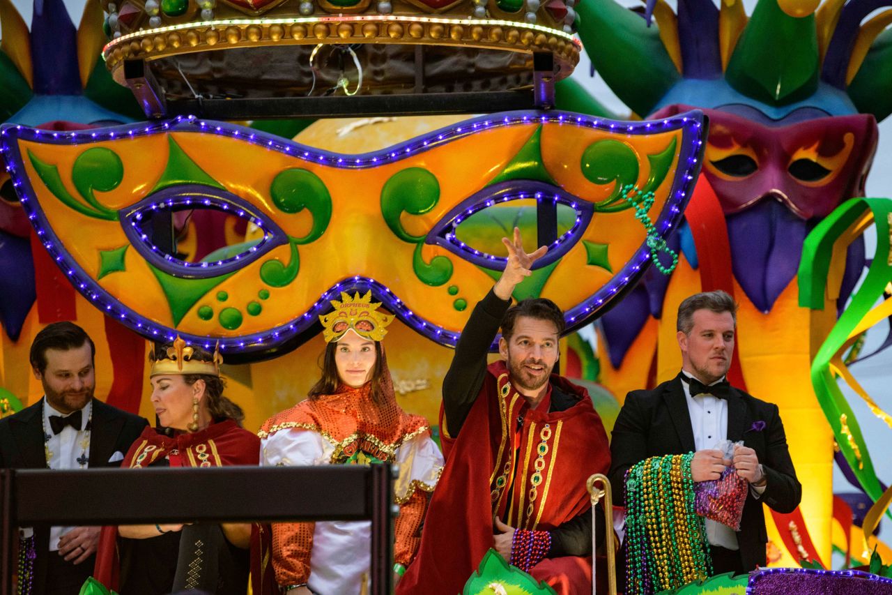 Singer and actor Harry Connick, Jr. throws beads with the Krewe of Orpheus, a group that he co-founded.