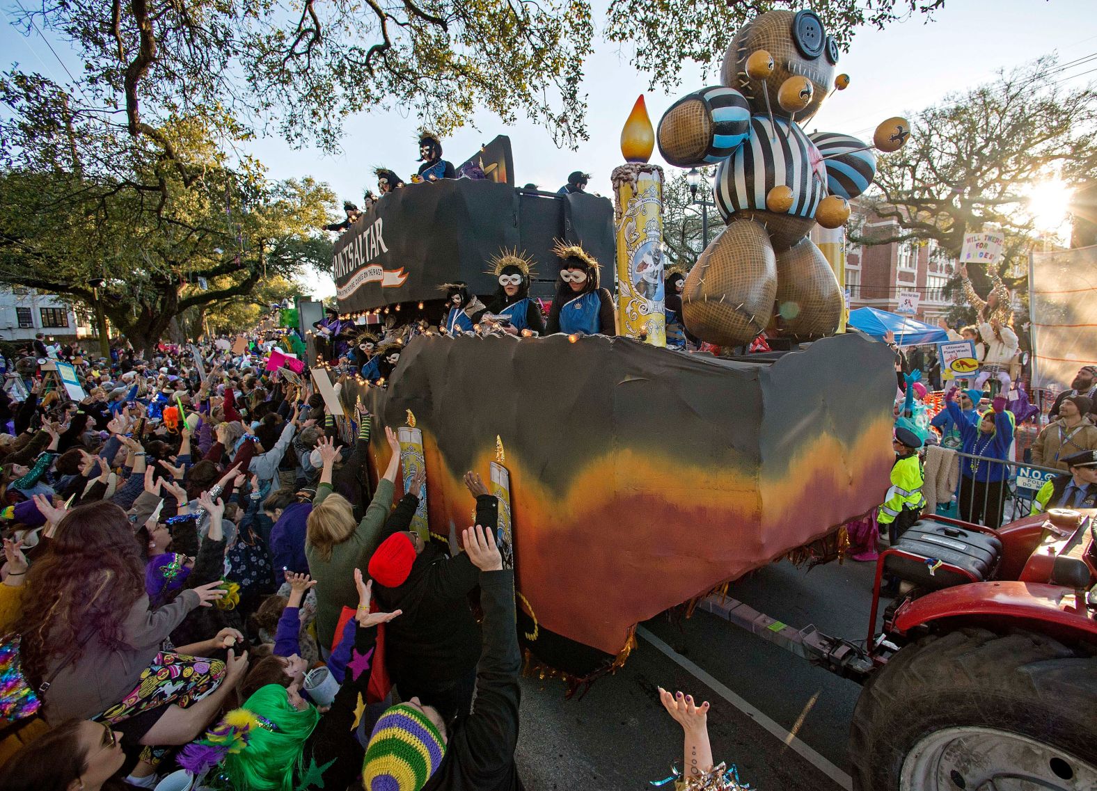 The Krewe of Muses celebrates its 20th year as it travels along the uptown route in New Orleans on Friday.