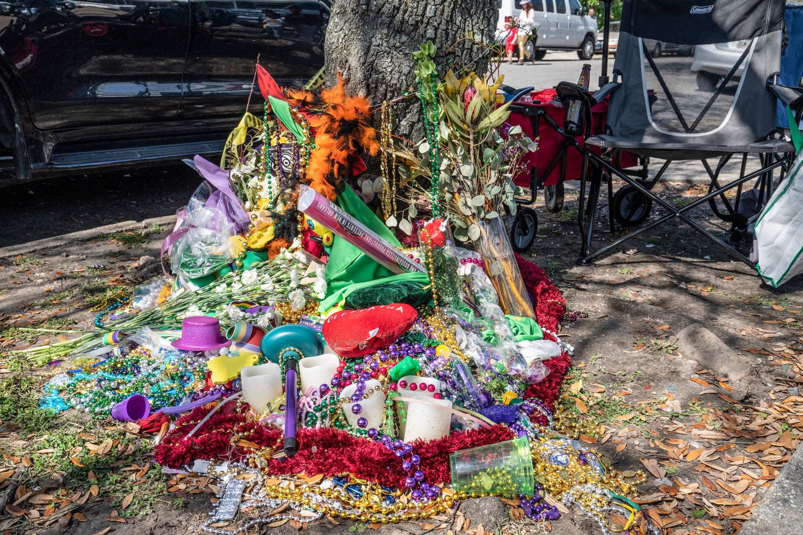 Paradegoers leave flowers and candles for a woman who was killed when she was hit by a tandem float this year. There was later another death that involved a tandem float, which has two or more floats connected together by a hitch and pulled by a tractor. New Orleans officials <a href="index.php?page=&url=https%3A%2F%2Fwww.cnn.com%2F2020%2F02%2F23%2Fus%2Fnew-orleans-person-killed-tandem-float%2Findex.html" target="_blank">banned tandem floats</a> in the wake of those deaths.