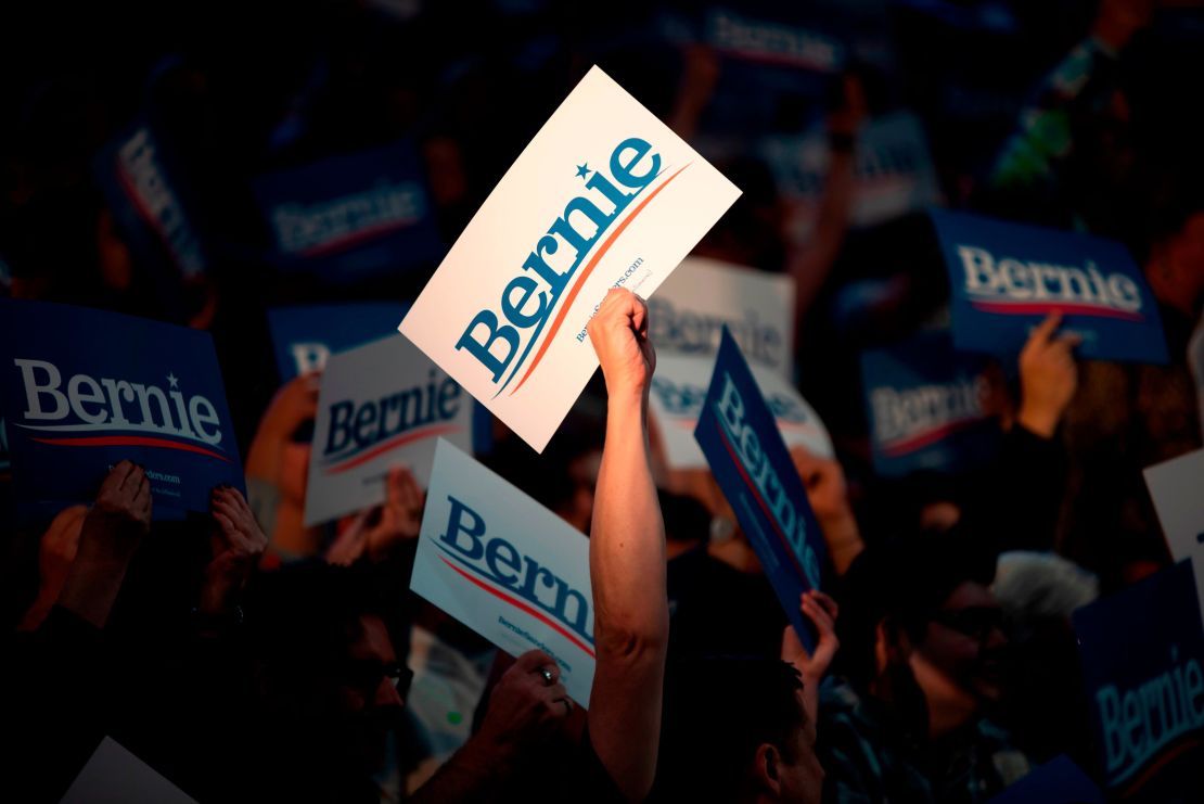 Supporters of Democratic presidential hopeful Vermont Senator Bernie Sanders cheer during a rally at Houston University in Houston, Texas on February 23, 2020. 