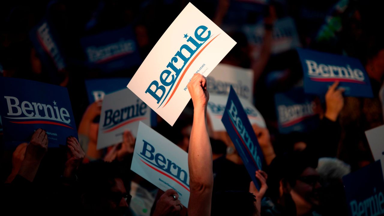 Supporters of Democratic presidential hopeful Vermont Senator Bernie Sanders cheer during a rally at Houston University in Houston, Texas on February 23, 2020.