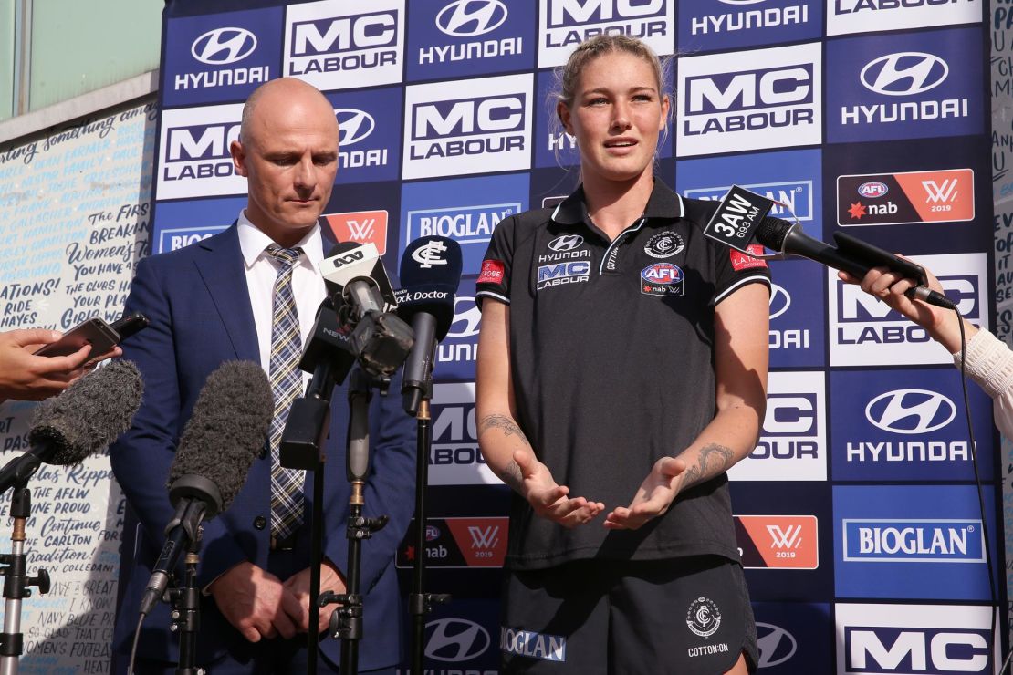 Harris speaks next to Carlton CEO Cain Liddle during a press conference at Ikon Park.