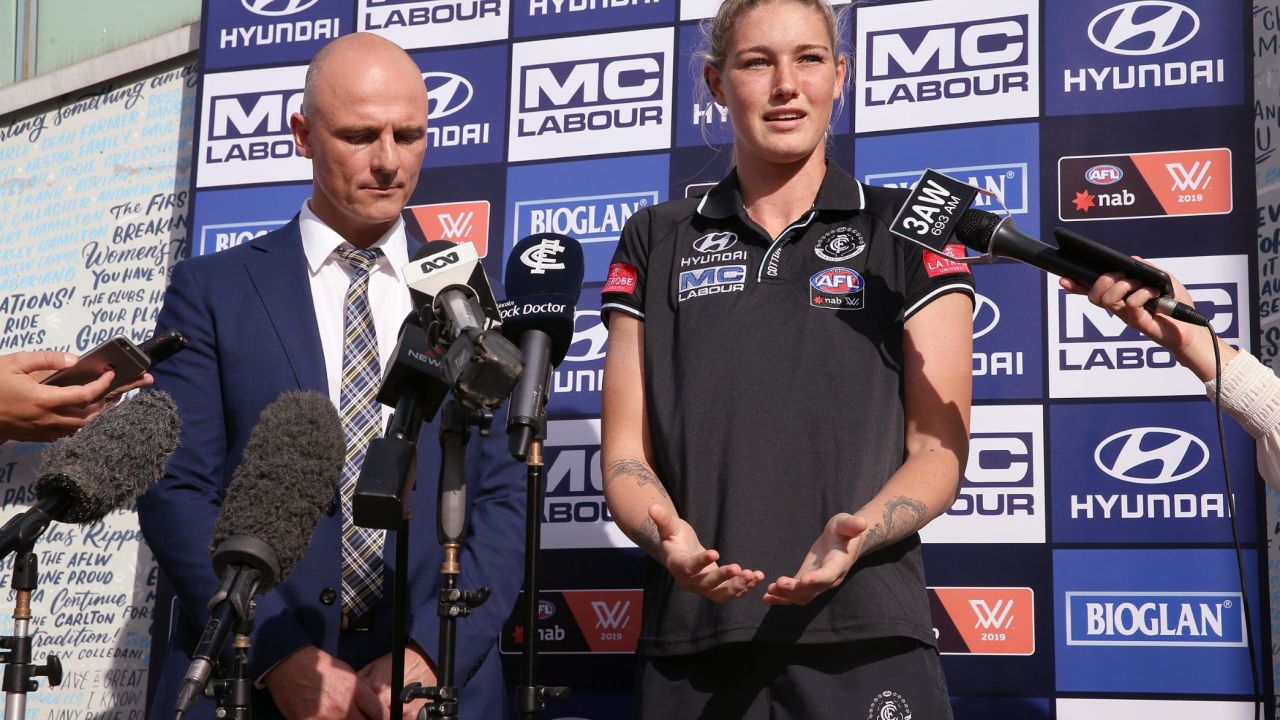 Harris speaks next to Carlton CEO Cain Liddle during a press conference at Ikon Park.
