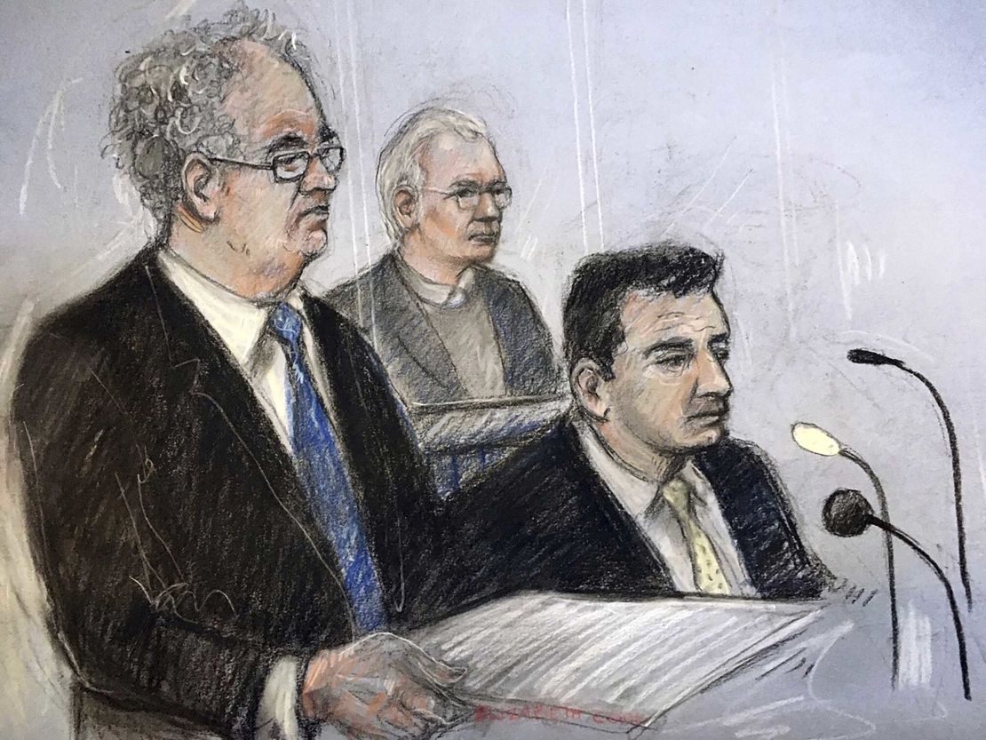 An illustration of Julian Assange, centre, in the dock with his defence team Monday.