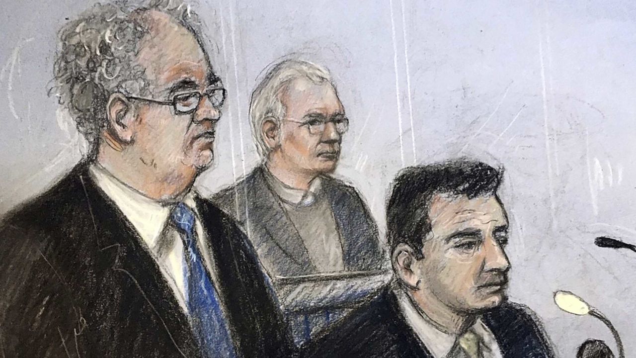 An illustration of Julian Assange, centre, in the dock with his defence team Monday.