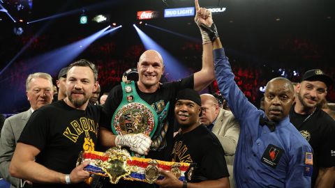 Fury celebrates his win by TKO in the seventh round against Wilder.
