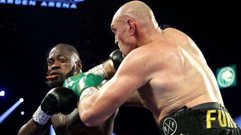 Fury (right) punches Wilder.