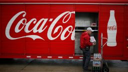 A delivery truck driver unloads Coca-Cola Co. soft drinks in Lawrenceburg, Kentucky, U.S., on Monday, Feb. 10, 2020. Coca-Cola rose after reporting better-than-expected revenue growth for the fourth quarter, citing rising demand overseas and higher demand for its low-sugar offerings in the U.S. Photographer: Luke Sharrett/Bloomberg via Getty Images