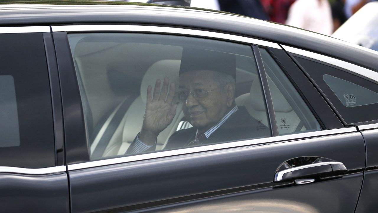 Malaysia's Prime Minister Mahathir Mohamad waves after he was granted an audience with King Sultan Abdullah Sultan Ahmad Shah at the National Palace in Kuala Lumpur, on Monday, Feb. 24, 2020. 