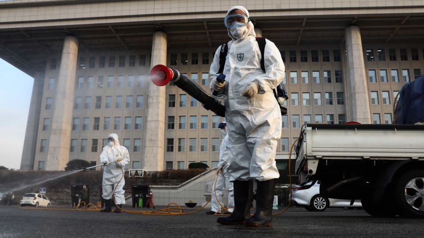 SEOUL, SOUTH KOREA - FEBRUARY 24: Disinfection professionals wear protective gear spray anti-septic solution against the coronavirus (COVID-19) at a National Assembly on February 24, 2020 in Seoul, South Korea. The National Assembly called off its plenary session and temporarily closed its buildings after it was learned that a coronavirus patient attended a parliamentary forum last week. Government has raised the coronavirus alert to the "highest level" as confirmed case numbers keep rising. Government reported 231 new cases of the coronavirus (COVID-19) bringing the total number of infections in the nation to 833, with the potentially fatal illness spreading fast across the country. (Photo by Chung Sung-Jun/Getty Images)