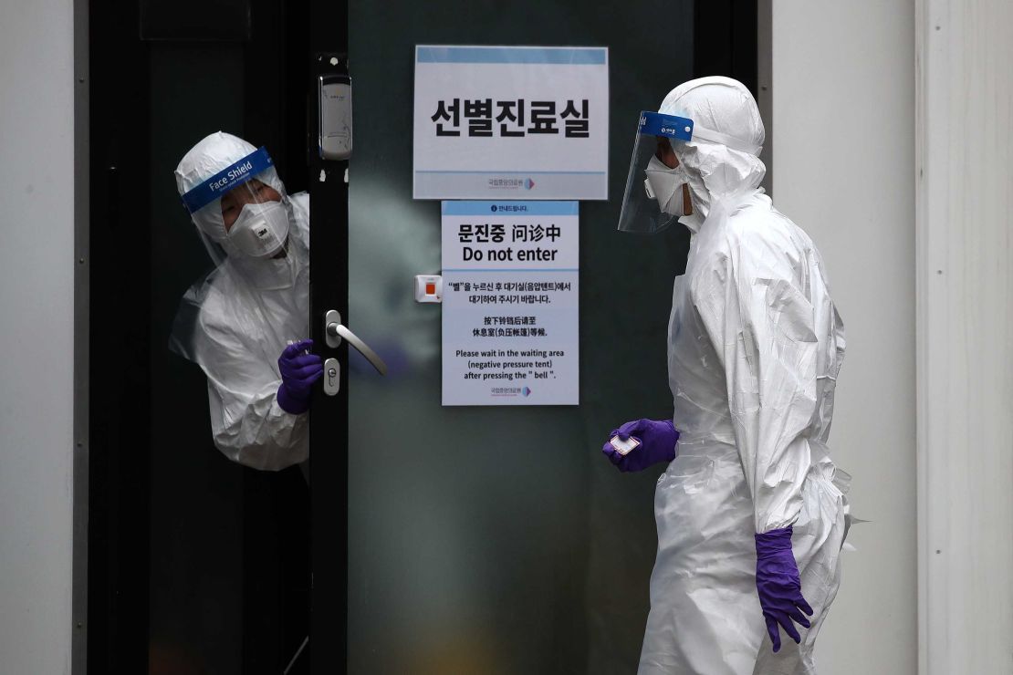 A disinfection professional wears protective gear and sprays anti-septic solution at the National Assembly in Seoul, South Korea, on on February 24.  