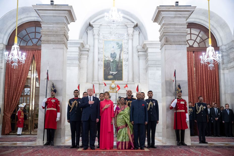 Trump and his wife, Melania, stand with Indian President Ram Nath Kovind and his wife, Savita, as the National Anthem is played before Tuesday's state banquet.